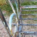 Wrought iron shelf on worked feet