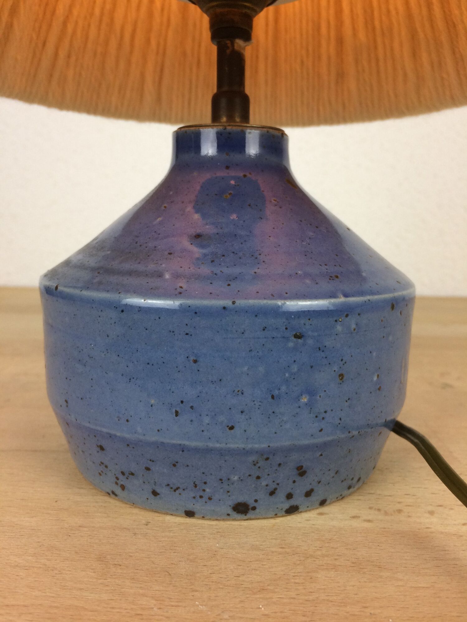 Blue ceramic lamp foot and white wool lampshade