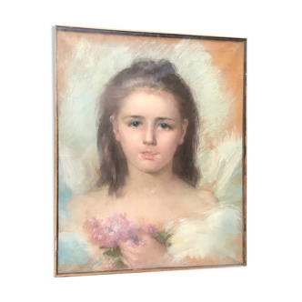 Portrait of a young girl with lilacs