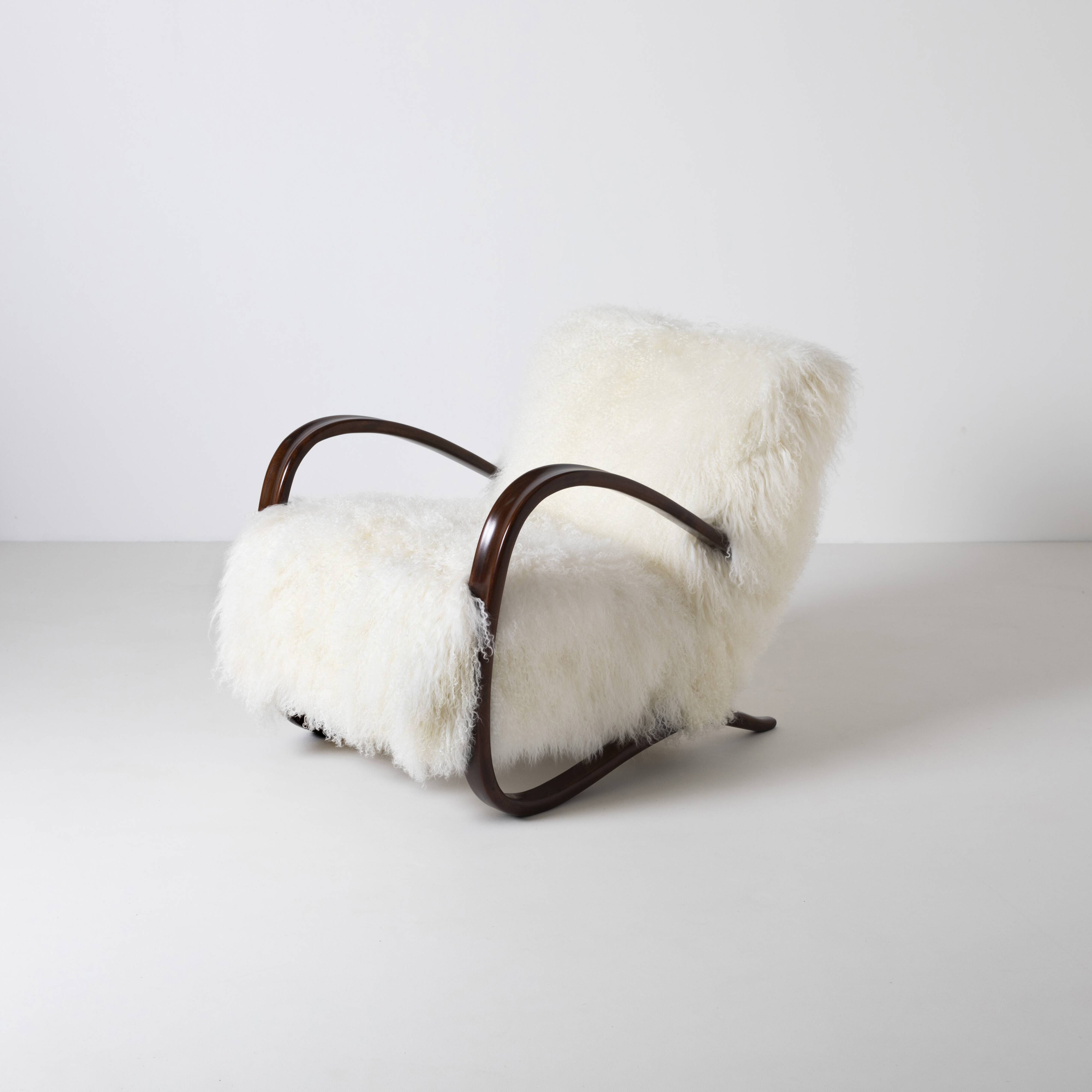 Pair of Jindrich Halabala H 269 lounge chairs in mongolian sheepskin