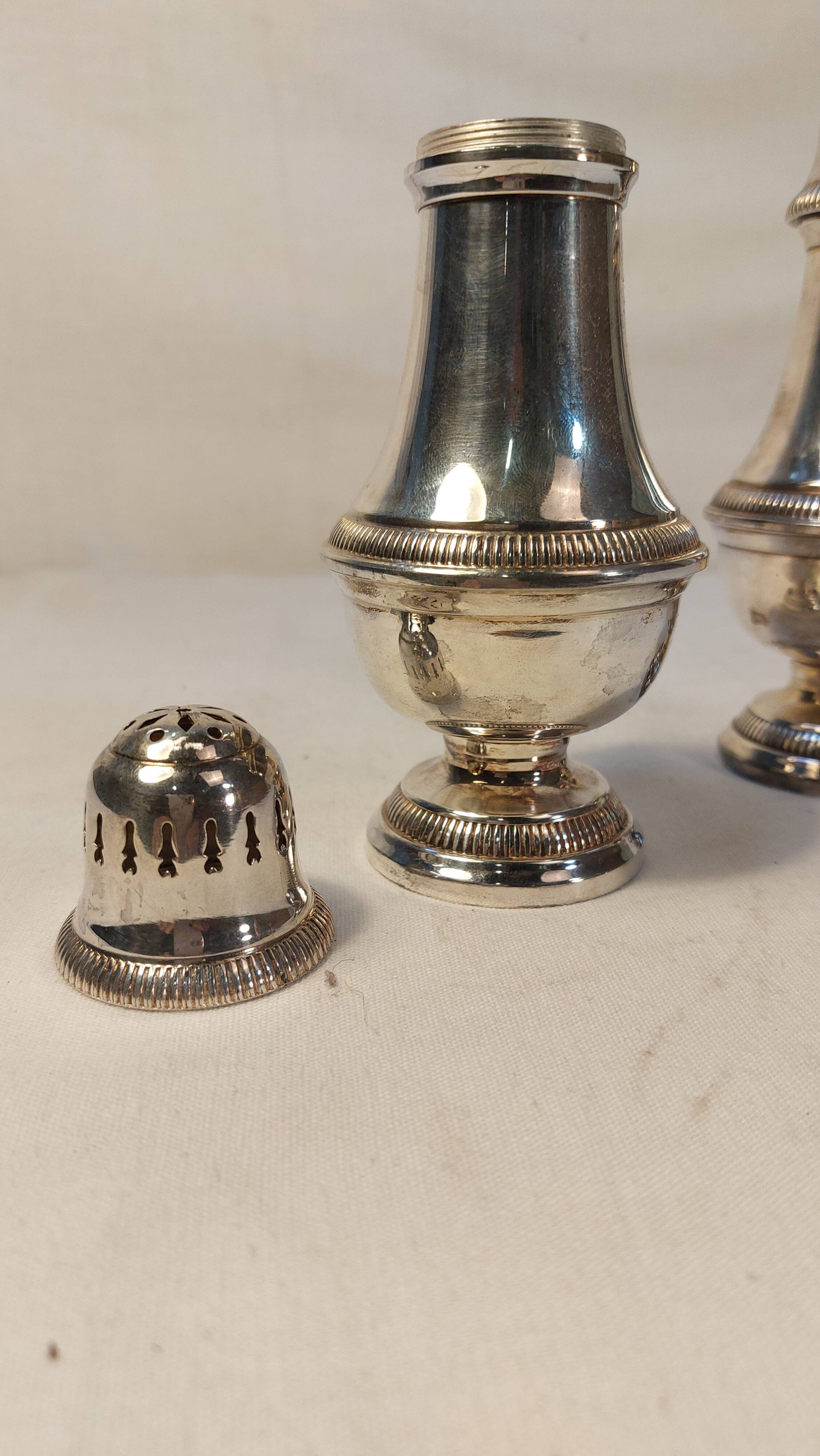 Set of two silver metal sprinklers