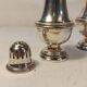 Set of two silver metal sprinklers
