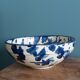 Empty pocket bowl in terracotta, glazed with "ink spots" design.