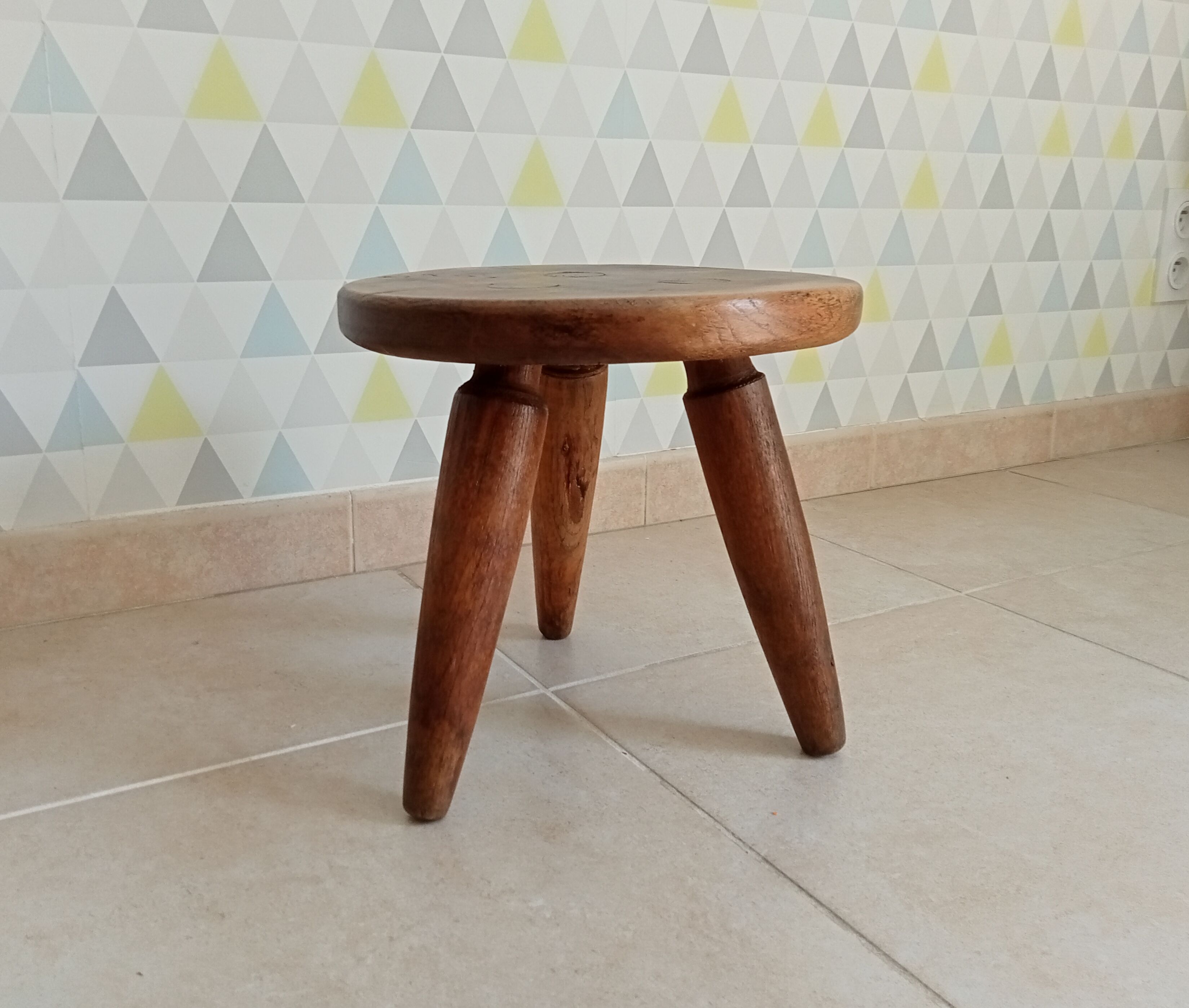 Antique walnut milking stool