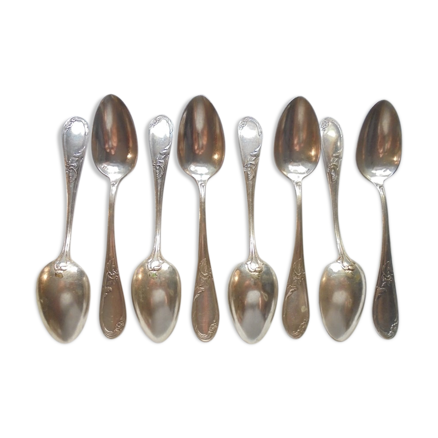 8 teaspoons made of silver metal