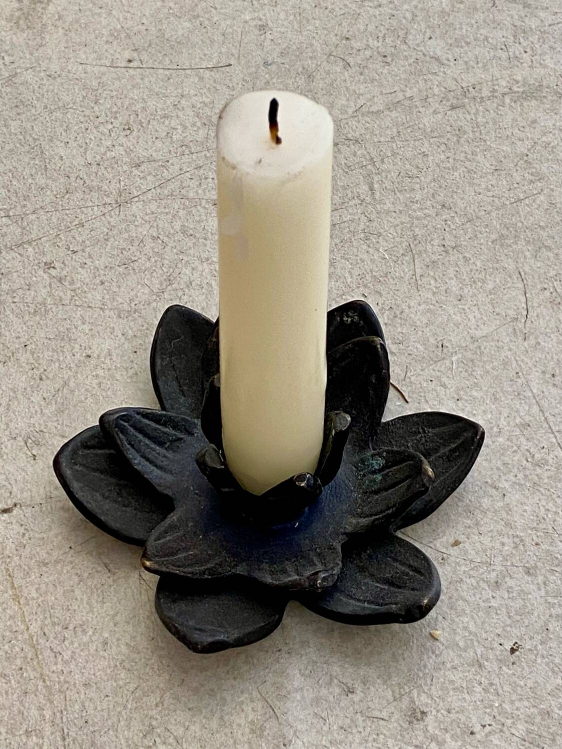 Cast iron candle holder