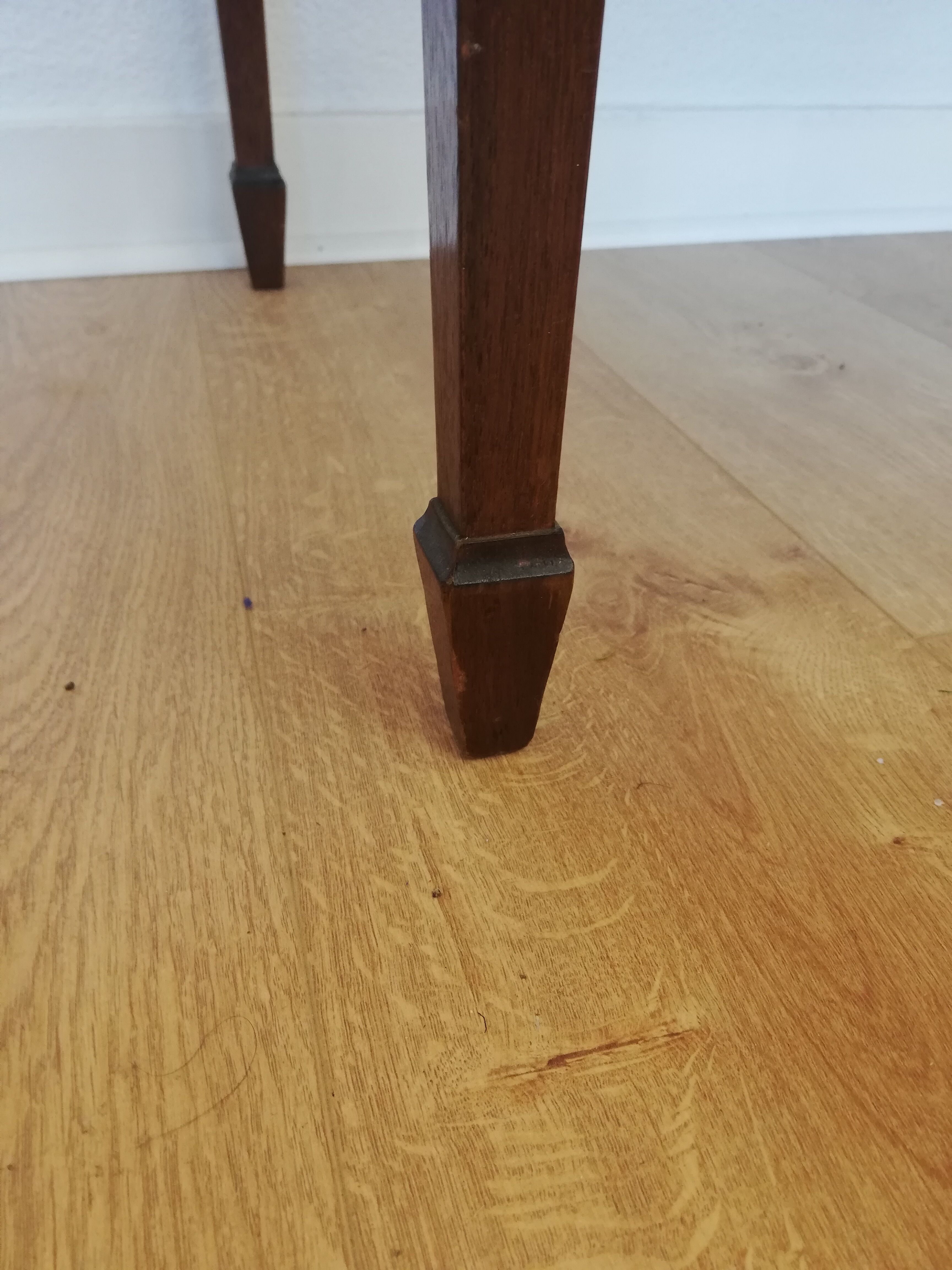 English wooden desk on top of leather