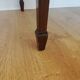 English wooden desk on top of leather