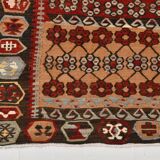 Kilim anatolien ancien tons rouges et beiges, motifs tribaux colorés