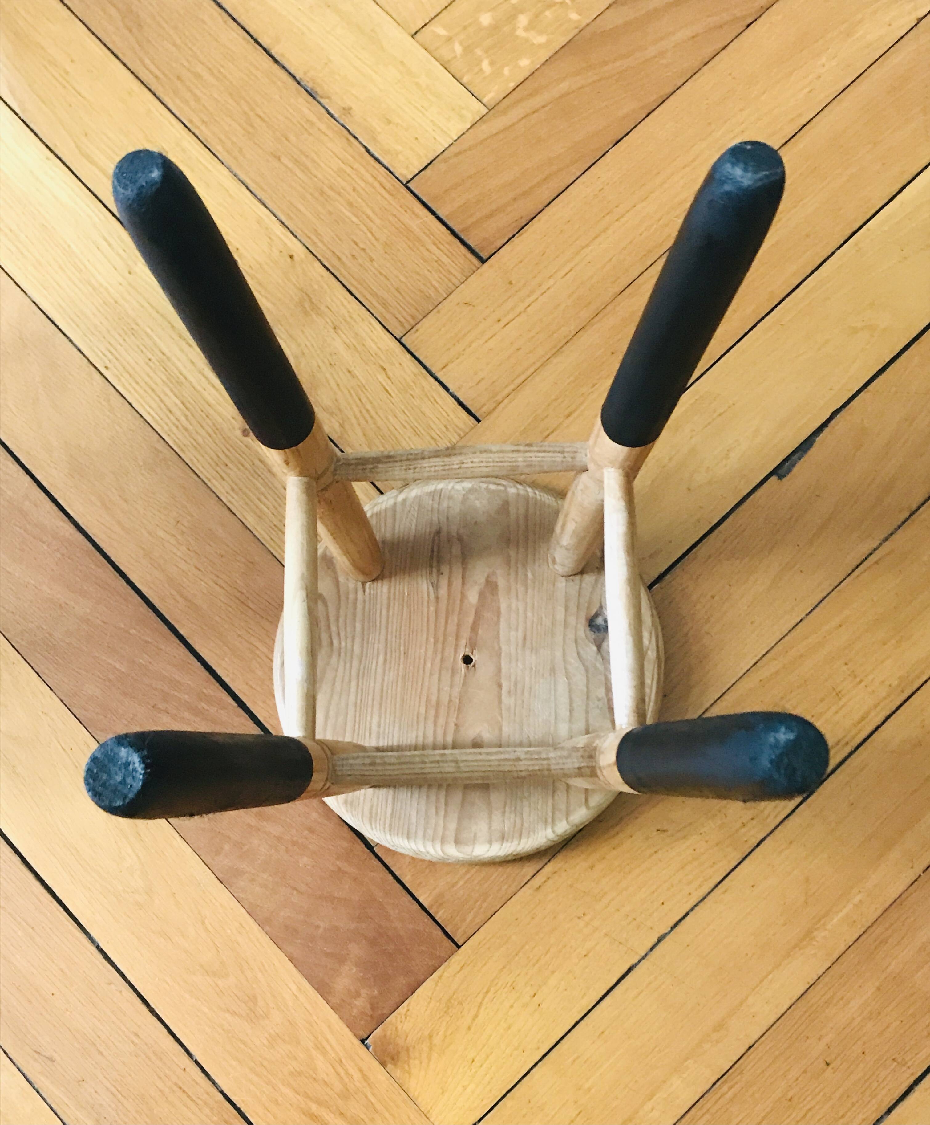 Solid wood stool with black legs