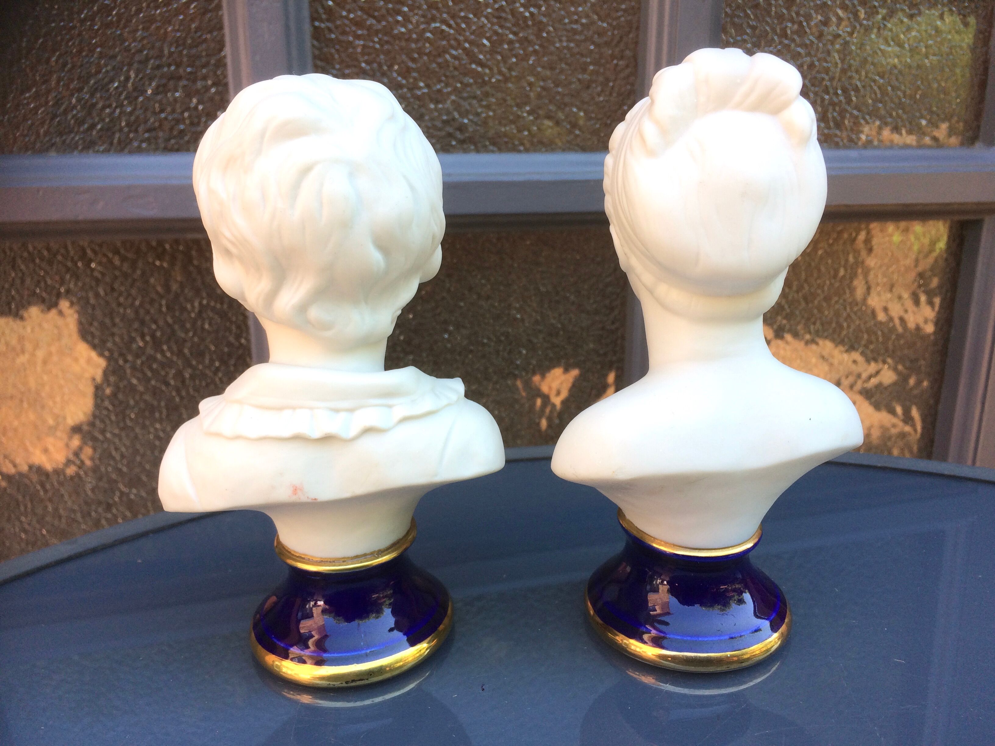 Children's busts in biscuit