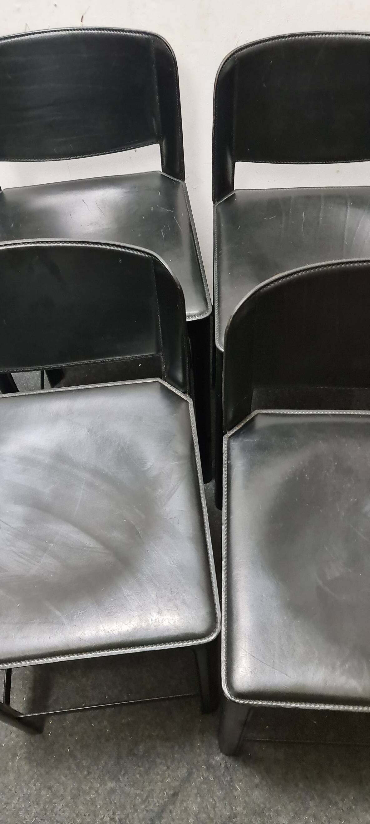 A set of four Italian leather bar stools by Matteo Grassi