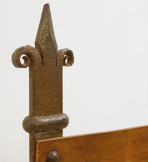 Curule armchair in wrought iron and leather