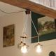 Scandinavian chandelier "Cascade" from the 1960s in brass, teak, and smoked glass.