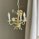 Small vintage cream metal flower chandelier with orange flowers and 3 arms.