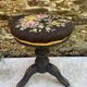 Old adjustable piano stool, blackened wood, metal screws, embroidered seat.