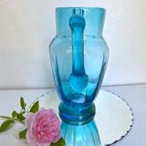 Old pitcher in blue glass