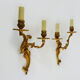 Former pair of double-light wall light in bronze or brass. Year 50 60