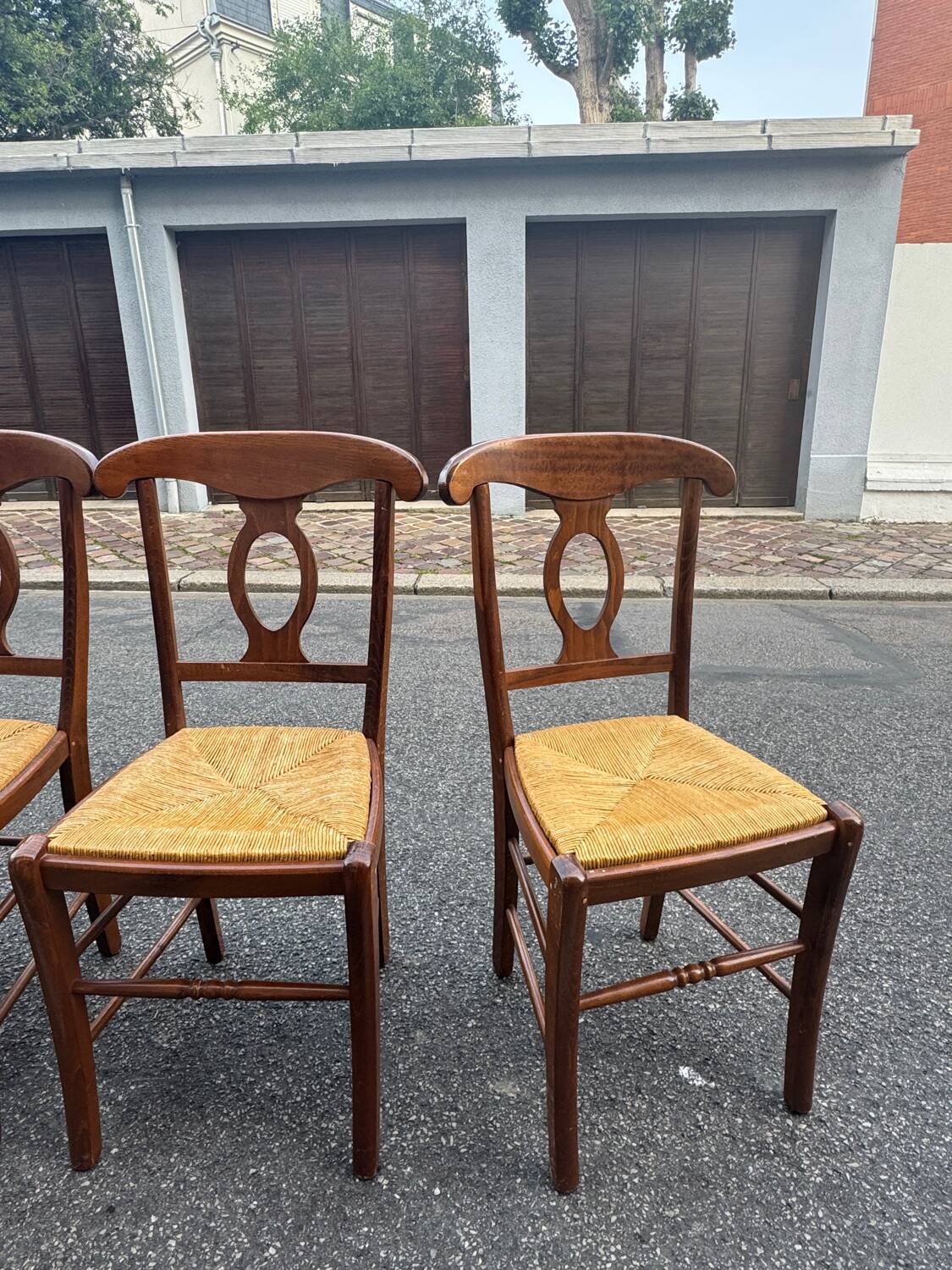 4 straw-seated chairs