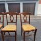 4 straw-seated chairs