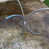 Table with chrome metal legs and smoked glass top.