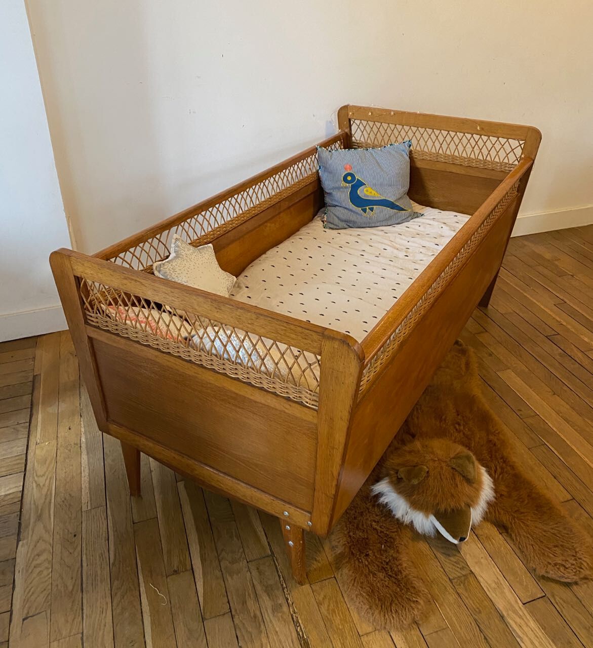 Wooden and wicker baby bed
