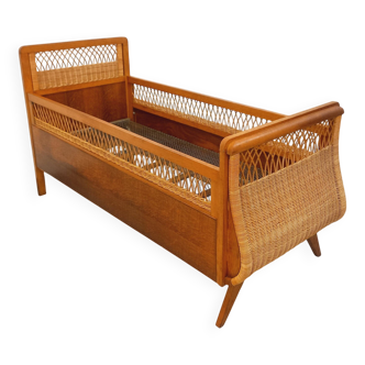Vintage oak and rattan baby cot from the 1960s.