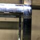Design in metal chrome and smoked glass shelf