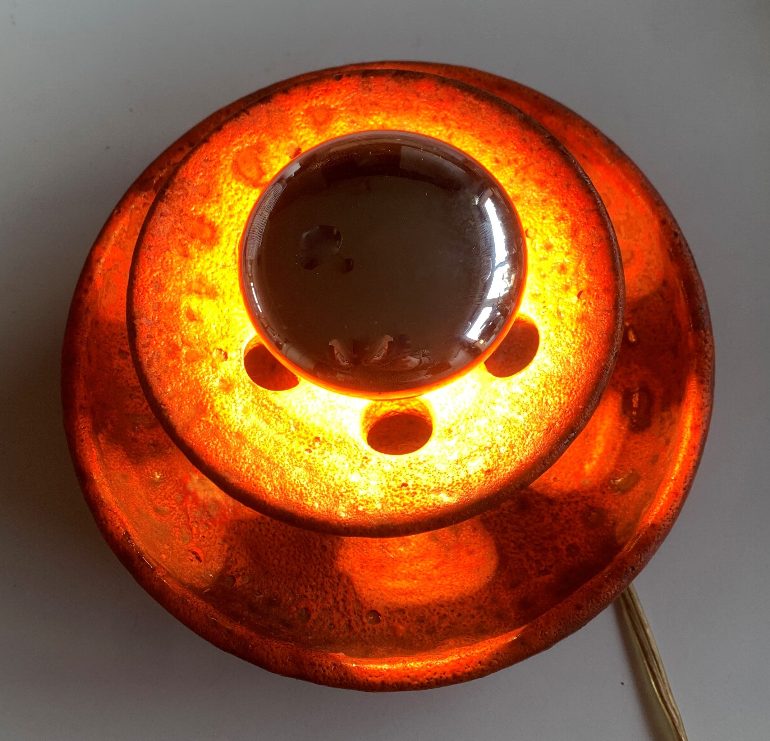 Ambient spot in orange glazed terracotta from the 1960s