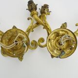 Paire d'appliques murales style Empire double feux en bronze