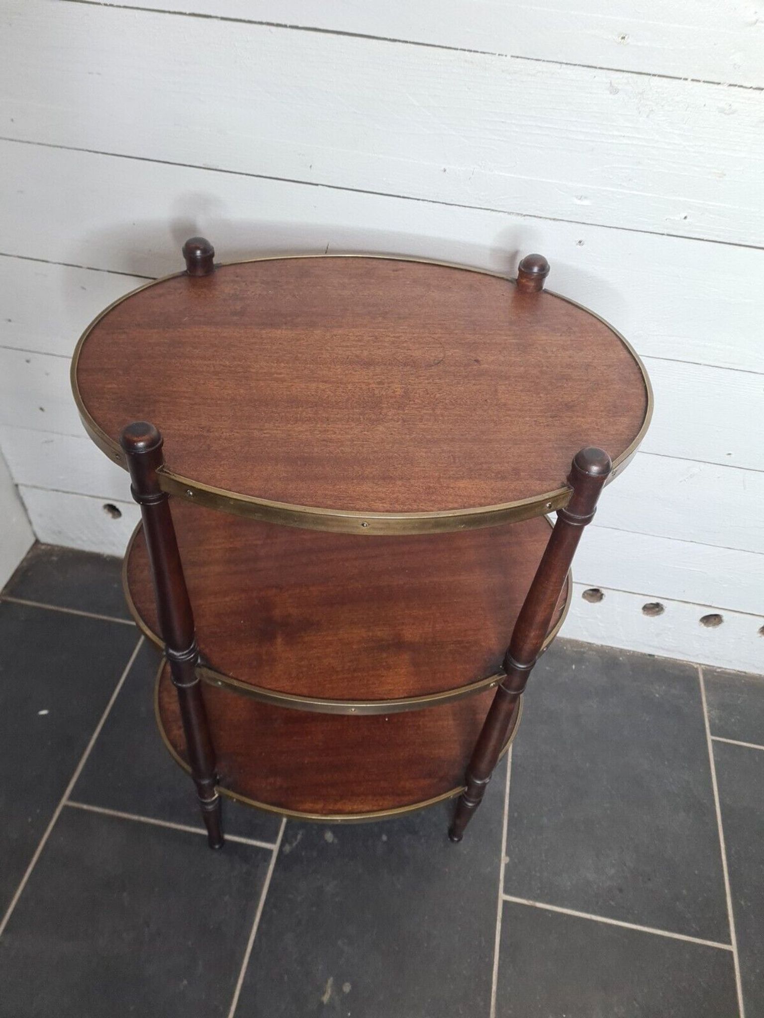 Oval mahogany side table has 3 floors