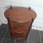 Oval mahogany side table has 3 floors