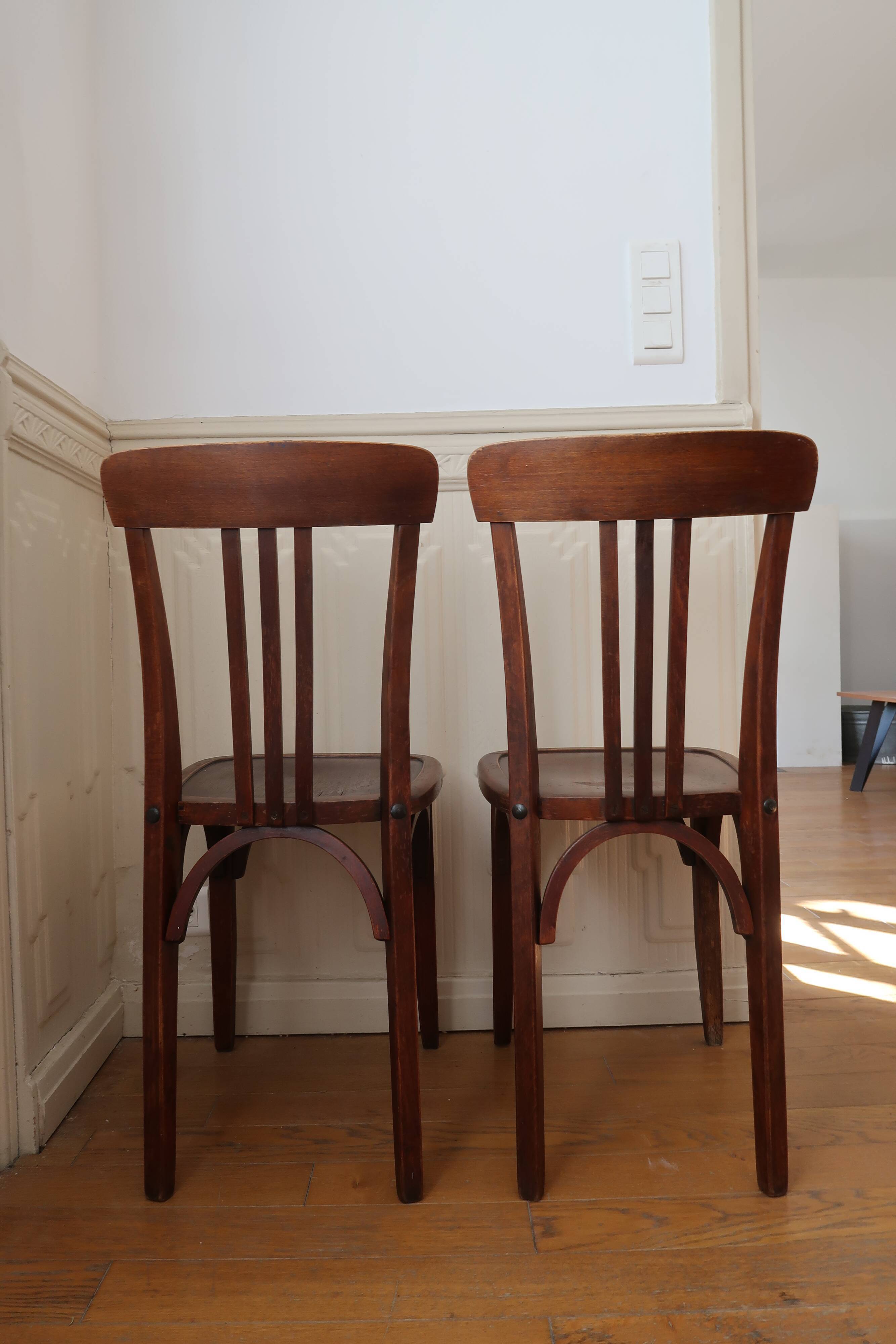 Pair of patinated bistro chairs