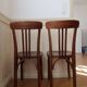Pair of patinated bistro chairs