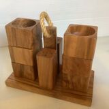 Six salt and pepper cherry-makers with their support