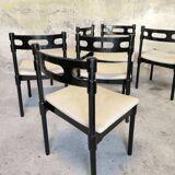 Set of six black lacquered wooden chairs.