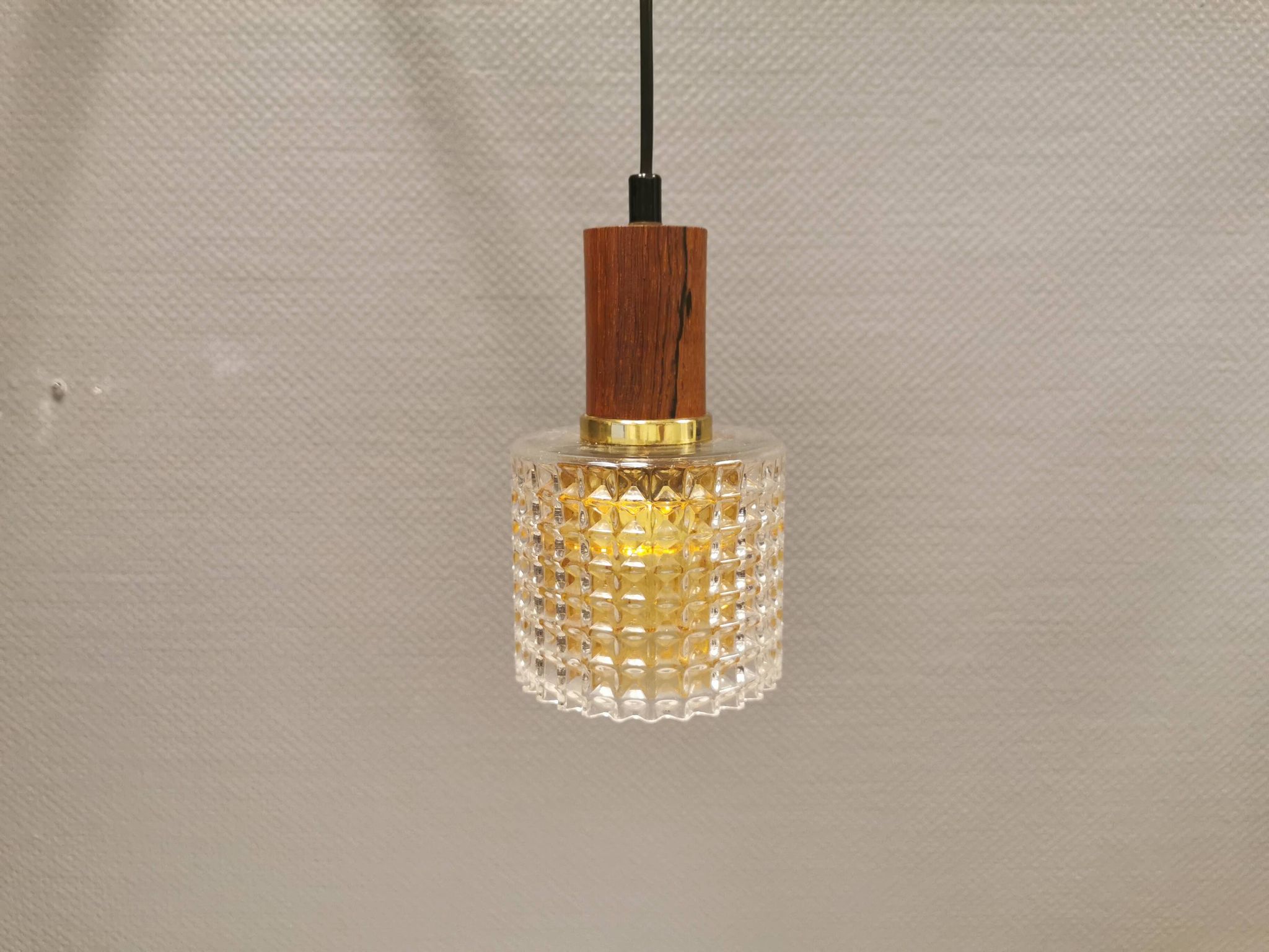 Older Swedish hanging lamp in multi-layered crystal glass with rosewood top and brass ring.