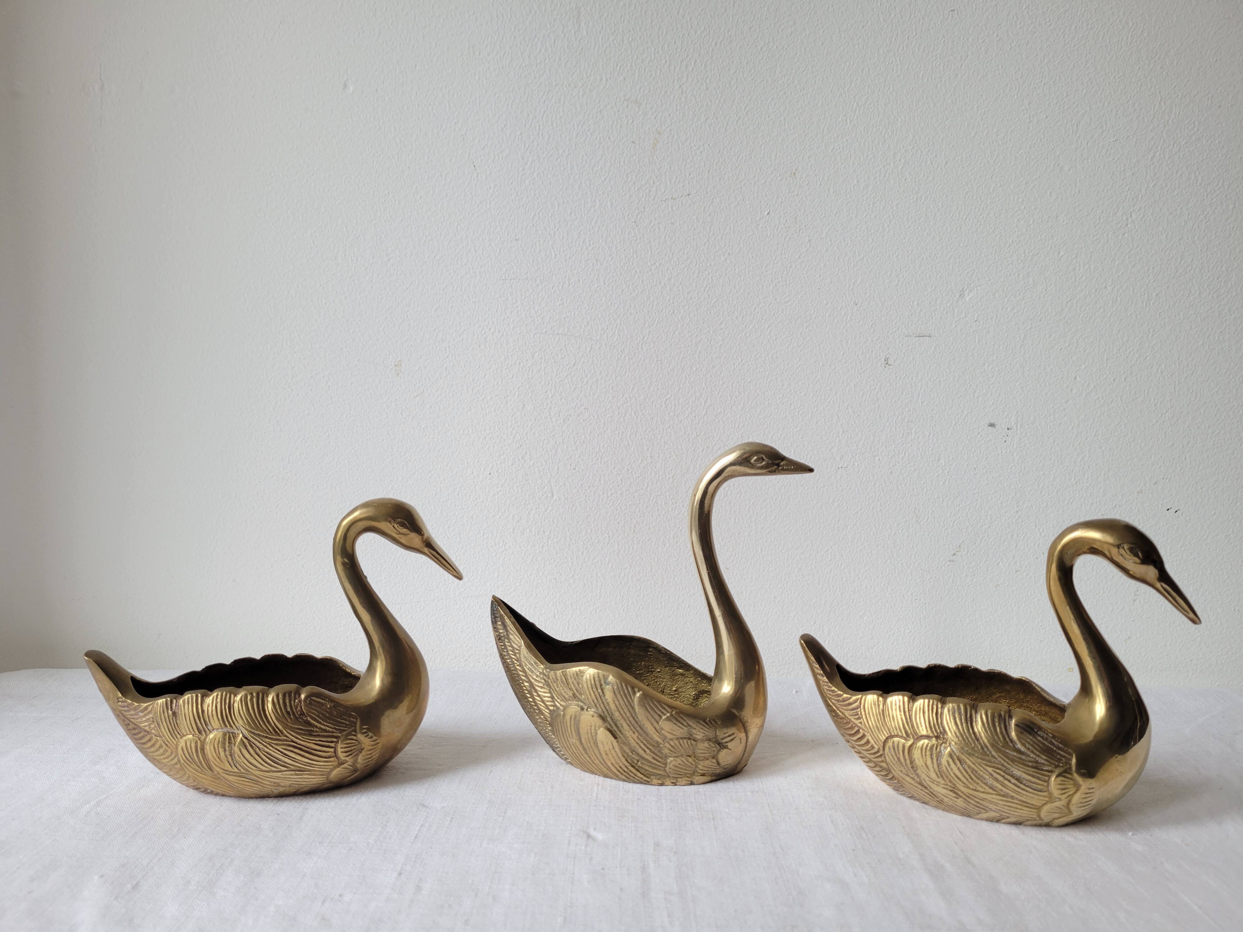 Trio of zoomorphic brass swan empty pockets