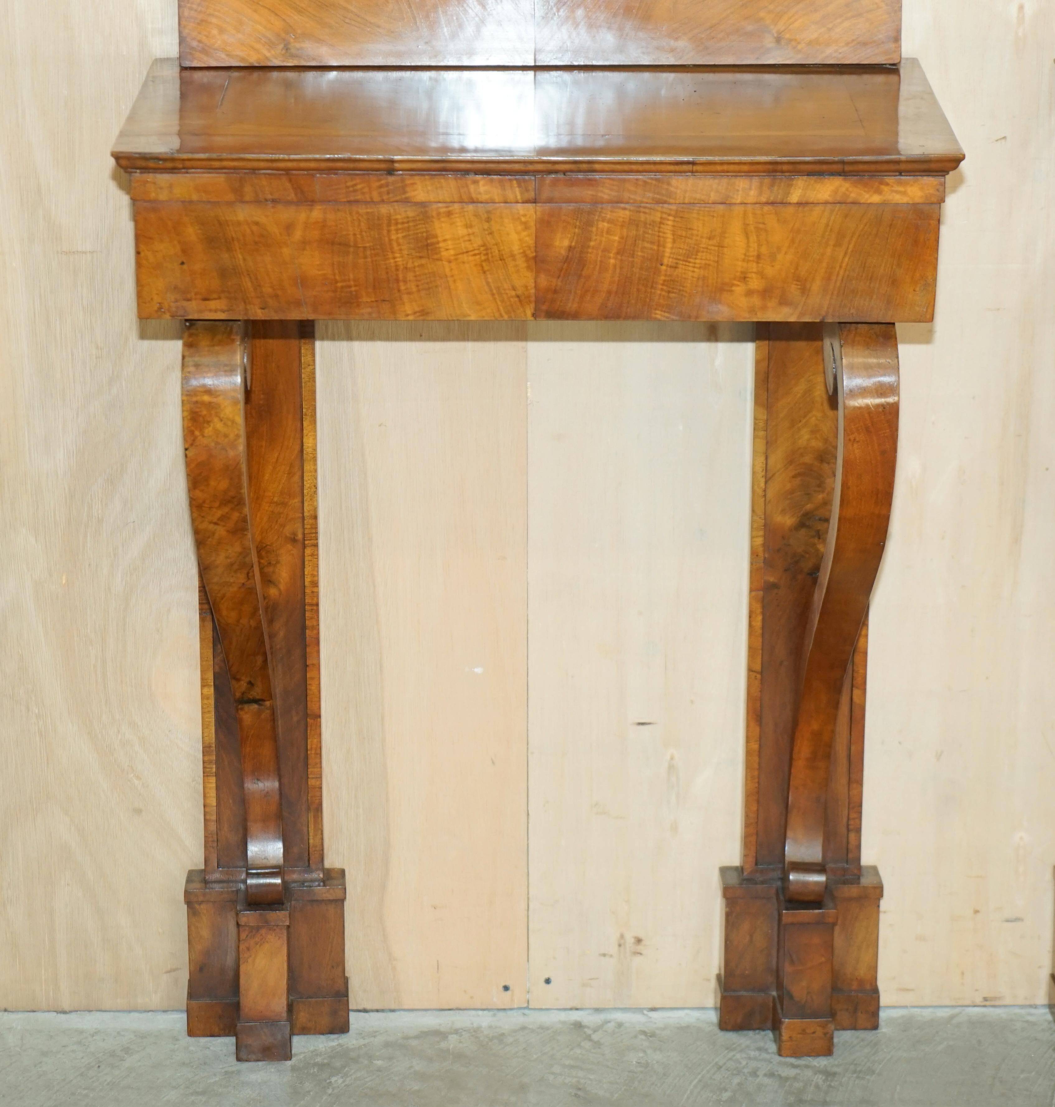 Pair of restored antique consoles from around 1815 in walnut, Regency style with mirror.