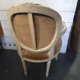 Louis XVI style bergère armchair in patinated wood