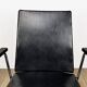 Fauteuil vinyle noir design années 50 dans le goût de Wim Rietveld