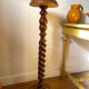 Antique pedestal table with a twisted column.
