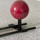 Vintage wall coat rack, metal and wood in yellow and red.