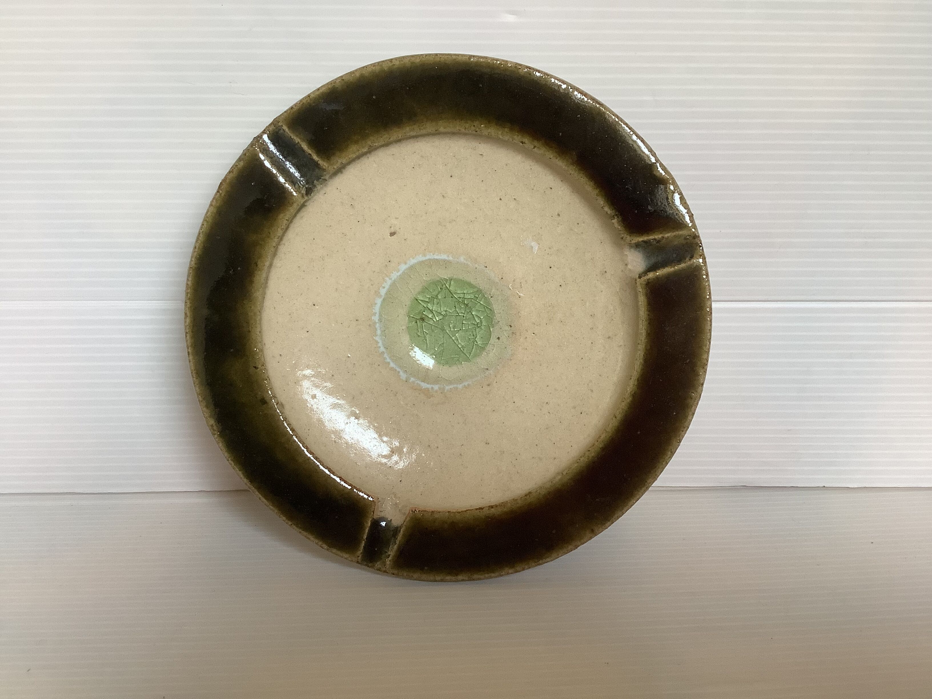 Green khaki beige ceramic ashtray tray.