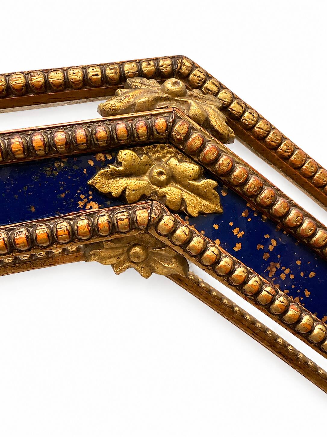Octagonal wall mirror in cobalt blue eglomisé glass and gilded wood, Spain.