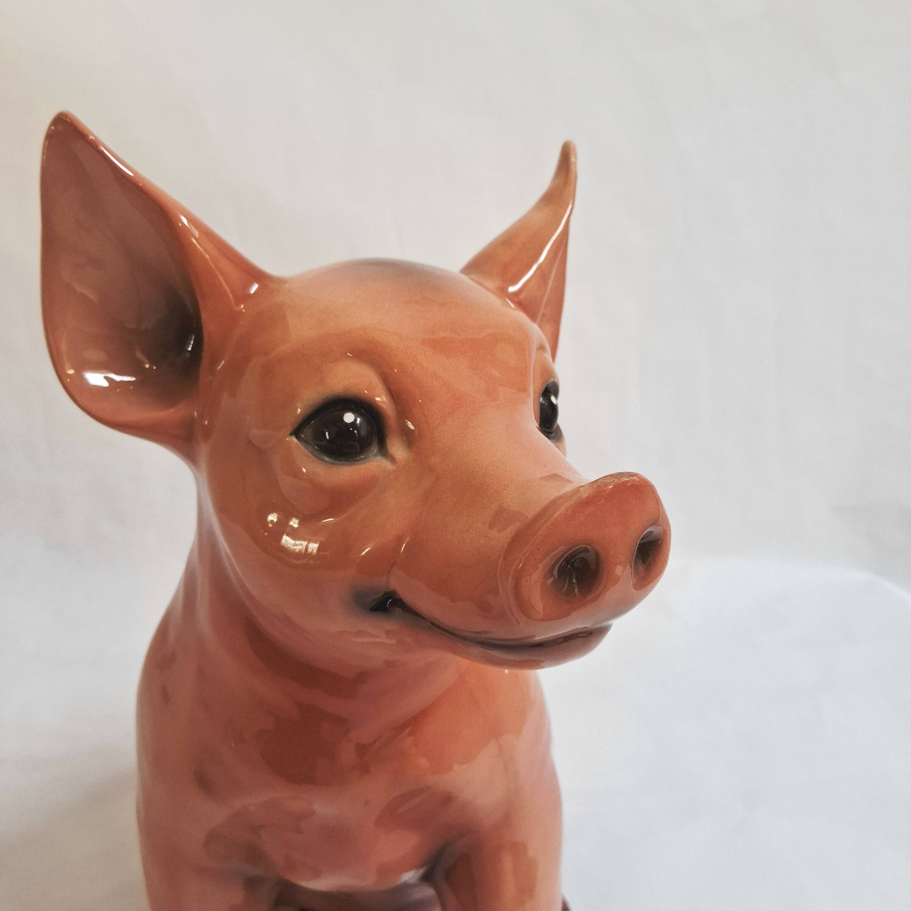 Beautiful, handcrafted porcelain figurine of a piglet, made by Capodimon.