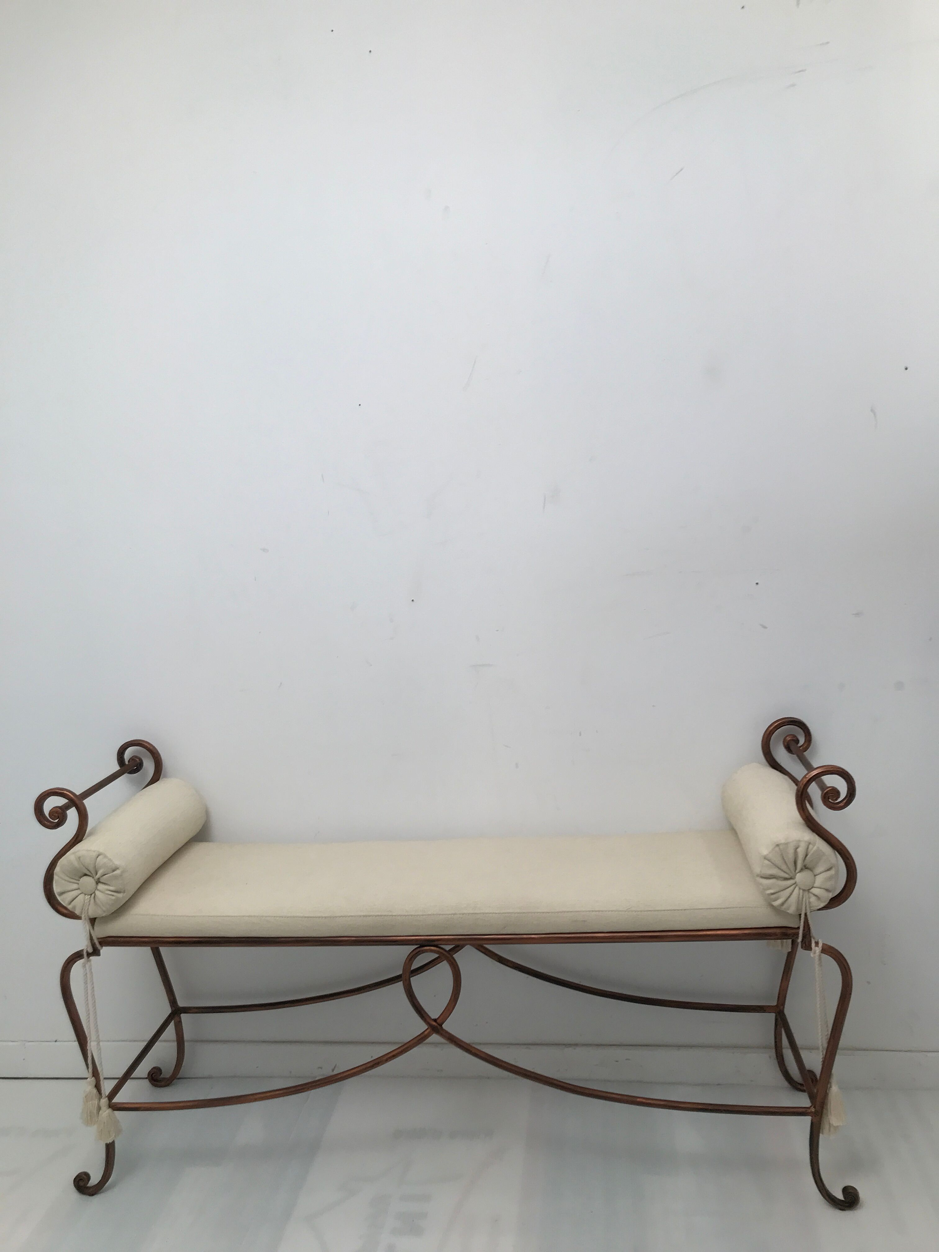 Copper wrought iron bench with cushions