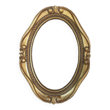Stylized oval gold frame