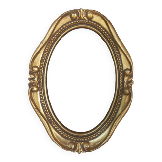Stylized oval gold frame