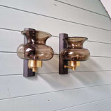 Pair of wall sconces in brass and smoked glass, 1960s.
